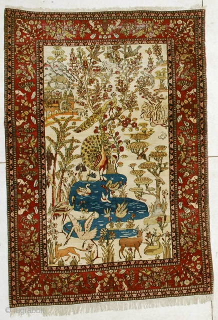 #6450 Laver Kerman Persian Antique Rug
This circa 1880 Laver Kerman antique Persian Oriental Rug measures 4’6” X 6’5”. It has a hunting scene and a tree of life design on an ivory  ...