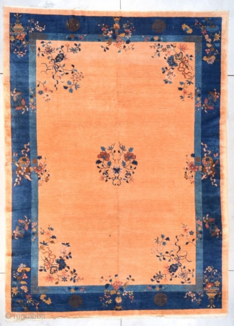 #7677 Peking Chinese Rug
This circa 1900 Peking Chinese Oriental rug measures 9’0” X 12’5” (274 x 381 cm). It has a small medallion of a wreath of flowers on a field color  ...