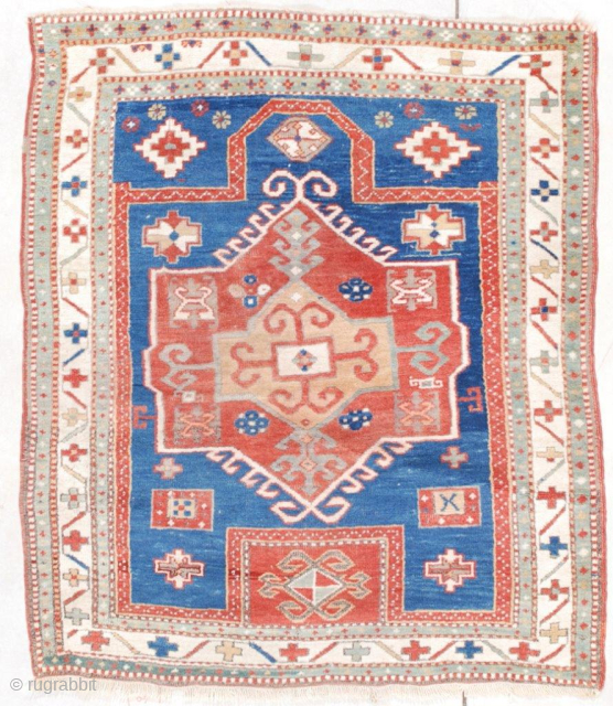 This mid 19th century antique Facralo Kazak Caucasian Oriental #7555 rug measures 3’8” X 4’4” (115 x 134 cm). It has a prayer motif with a re-entrant at the bottom (exactly where  ...