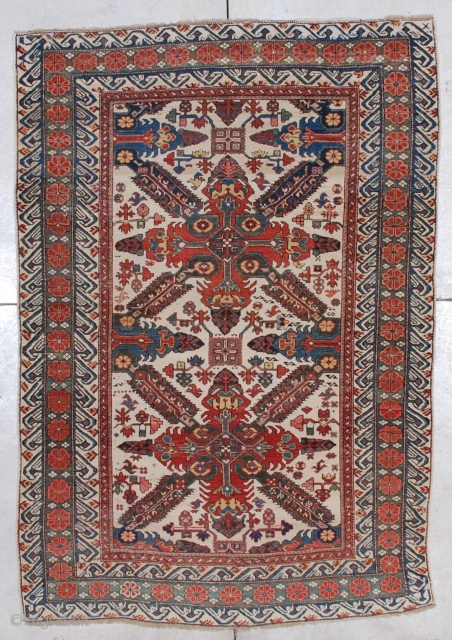 
#5626 Seyhore Kuba Antique Caucasian Rug
This circa 1875 Seyhore Kuba Antique Oriental Rug measures 4’5” X 6’5”. It has two complete Saint Andrews crosses on an ivory ground. It has nice asymmetrically  ...