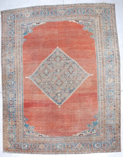 #6705 Mahal Antique Persian Rug 
This antique Mahal Persian Oriental Carpet measures 10’7” X 13’6”. It has a fantastic deep terra cotta ground with a pale blue diamond medallion. It has small  ...