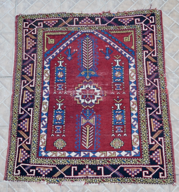 Antique Bergama rug, West Anatolia.  118 x 106 cm ( 3.9 ft x 3.5 ft) Second half of 19 th. century. The design  with a white blossom at the centre.  ...