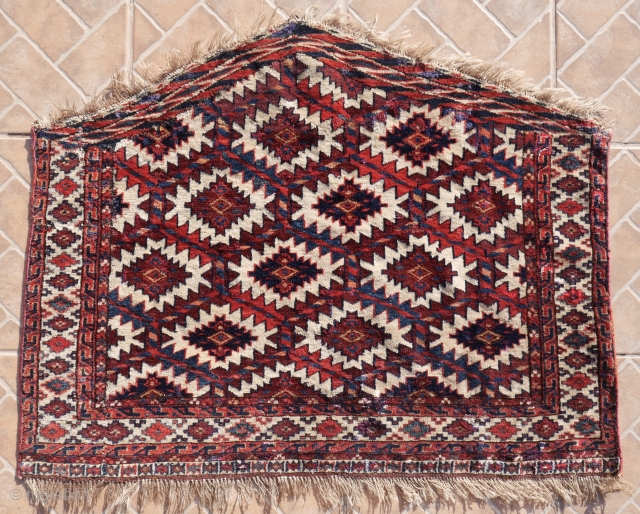 Yomud Asmalyk, 94 x 52 cm. circa 1850. Well-spaced, squarish model with a nice, old blue-green colour. A few areas of wear and repair. 
        