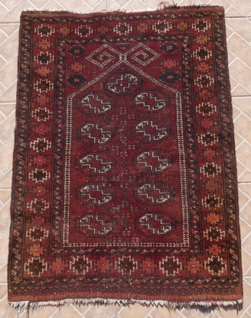 An Antique Ersari (Beshir) Prayer rug with ram's horn design. 112 x 84 cm (3.7ft x 2.75ft.) The border with" dogajik" motifs with a nice, natural rusty orange colour.    