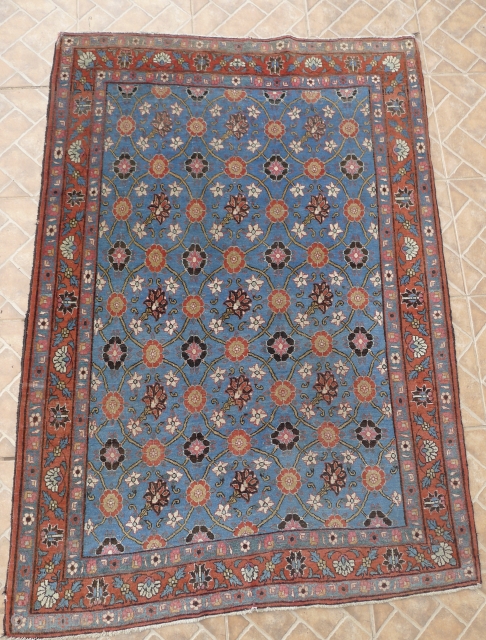 A Najafabad-Isfahan "Mina Khani" design rug, about 60 y.o. 160 cm. x 106 cm.
fine and tight weave. Lovely sky blue ground colour. Shortly cropped to enhance the precision and fineness of the  ...