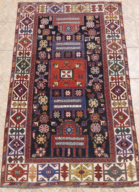 Shirvan 'Throne' Rug, Shemakha district, Maraza village. 185 x 114 cm. ( 6ft x 3.7ft) around 1910.  The design with two opposing "Thrones"  with a central squarish medallion on a  ...