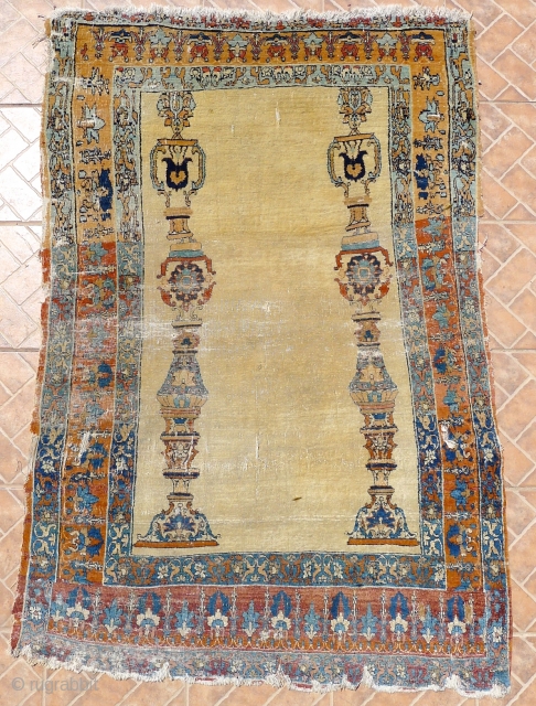 An 'Hadji Jalili'  Tabriz Eternal Column Rug, 175 x117 cm. (5.75ft x3.8ft.) NW Persian. Circa 1850.  This extraordinary prayer rug, only shows the basic design features of border and coupled  ...