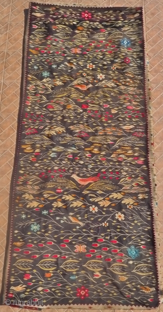  An Oltenian Folk Kelim fragment, 9ft x 3.7ft. (275 x 115 cm.) Southern Romania, early 20 th. century. The design with birds and butterflies together with various floral motifs: oak leaves  ...