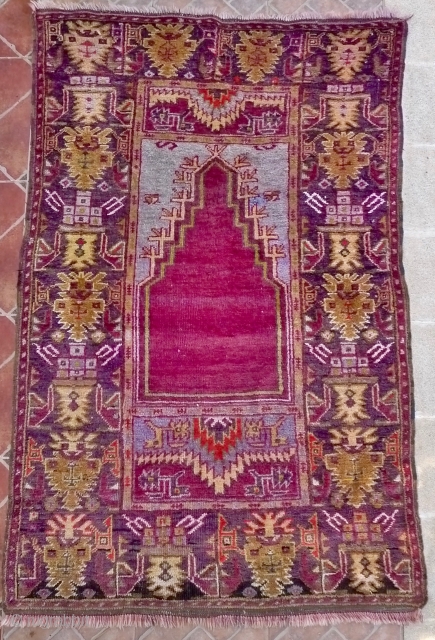 Çamardı/Niğde Prayer rug, Maden region, Central Anatolian. 5.3ft x 3.4ft (163 x 105 cm.) Circa 1930
Atractive rug with magenta red prayer niche on a pale blue ground. Border design with large palmettes  ...