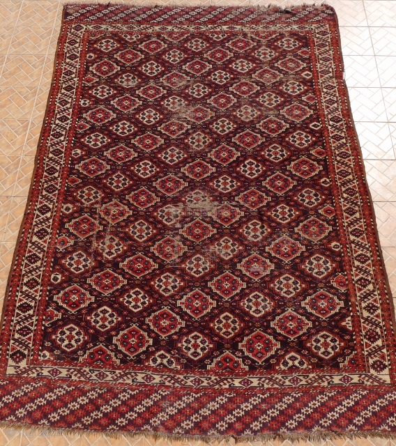 Chaudor/ Chodor Main Carpet, 11ft x 7.7ft. (335 x 235 cm.)
late 19 th. century. Characteristic Ertmen Gol design on dark purple-brown ground.
$850 USD plus $75 P&P (insured)      