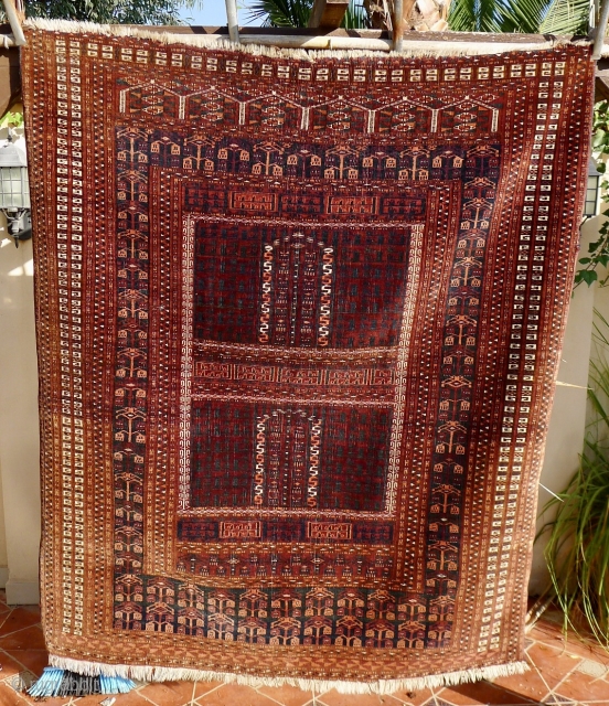 An antique Saryk Ensi, 5.25ft x 4.4ft, around 1900.  Type C class: main border with drooping blossoms, but without the inner meandering animal border. Good colours, mainly chocolate brown and blue-green. 