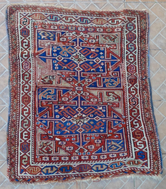 Bergama Rug, NW coastal Turkey, 108 x 95 cm. 1850 or earlier.
The design with two cruciform medallions.
Beautiful proportion of indigo blue, ivory and pistache green on a madder red ground.
Attractive white ground  ...