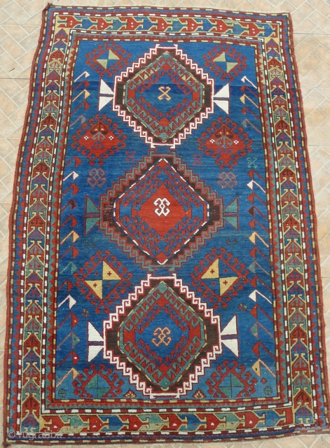 Kazak Rug, possibly Shulaver area. 218 x 145 cm. (7.15ft x 4.75ft) late 19 th. century. The design with typical hooked and crossed lozenges.  Attractive border with stylized bird in flight  ...