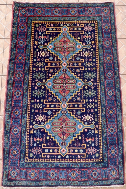 An Ugakh Kuba Rug, Divichi district, Azerbaijan. 158 x 96cm. (5.2ft x 3.15ft) ca. 1920/30 The dark blue field with
three stepped lozenges in sky blue, divided by golden yellow rods. Classic kufic  ...