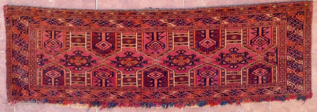 Saryk Kejebe Torba, 114 x 36 cm. 19 th. c. The design with 5 pairs of kejebe arches on a dark violet-red ground.
No multiple sub borders. Simply one main border, framed by  ...