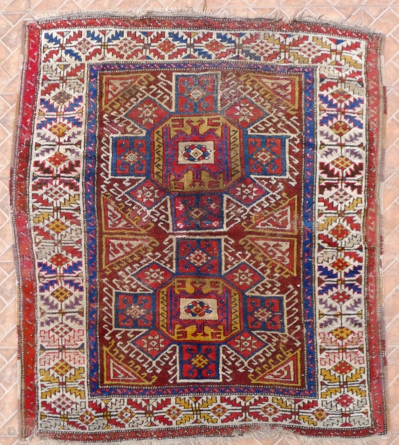 West Anatolian Bergama area rug, 4.7x5.3ft. mid 19 th. cenury. The design with two octagonal eight pointed star motifs (Holbein type)
Classic border with diamond and serrated leaf pattern. Condition: areas of wear  ...