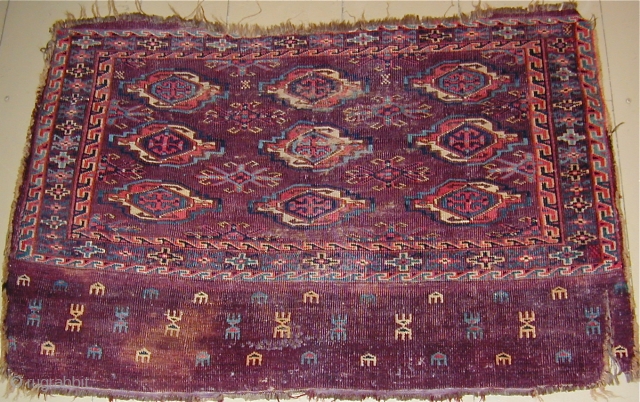 Turkmen Chuval with beautiful colors needful of a bath, some staining,asymmetric knot open R.
43'' X 28''(109 X 71cm), early 19th. century.            