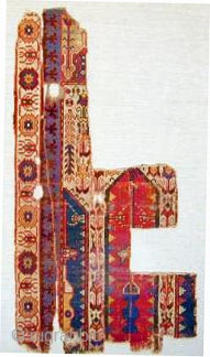 Fragmentary tripartite prayer rug, mounted
53" X 28"[135 X 71cm]                        