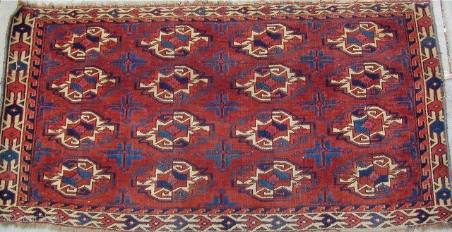 Archaic Yomut Chuval with wonderful colors including lots 
of corrosive insect dye highlights throughout the piece,
finely woven with good pile, luminescent wool,
and a pepper and salt back, Ca. 1800, 42''X 22''  