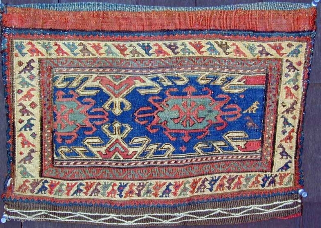 Rare Sumak Chanteh showing a border with a procession
of vari-colored birds, complete with original embroidered
striped back, early natural dyes including aubergine,
19th. century, 17" X 12"[43 X 31cm], MINT     