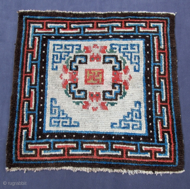 Tibetan square seating mat, 25" X 24" [64 X 61 cms.]
19th. century, all wool with natural dyes                