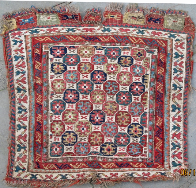 Rare finely woven Sumak bag-face with unusual  multicolored reciprocal design on a white cotton field, cloth-like handle, 19th. century, 21" X 20"[54 X 51cm]        