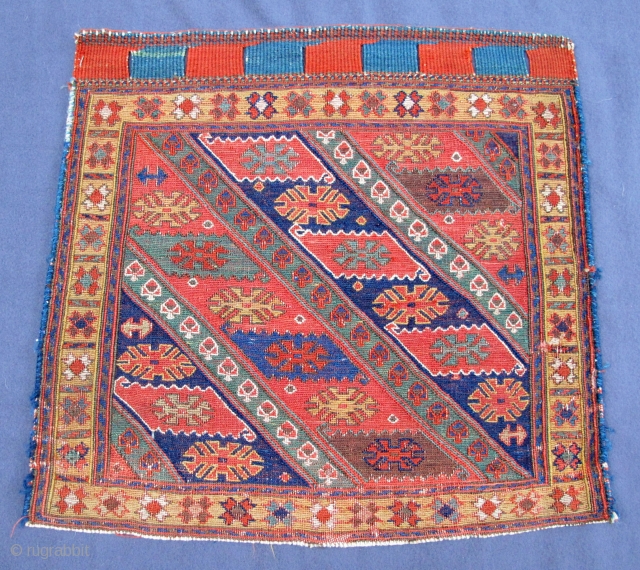 Rare N.W. Persian Soumak bag-face of the early 19th. century,
22" X 21"[56 X 54cm]                   