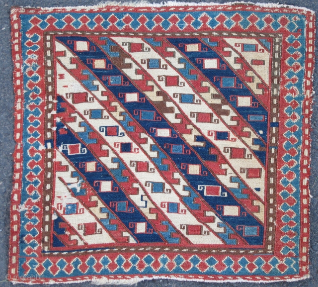 A most unusual Sumak Bag Face with warps in clusters of silk, wool, and cotton/silk wefting,
early 19th. century, 18" X 17"(46 x 43cms)          
