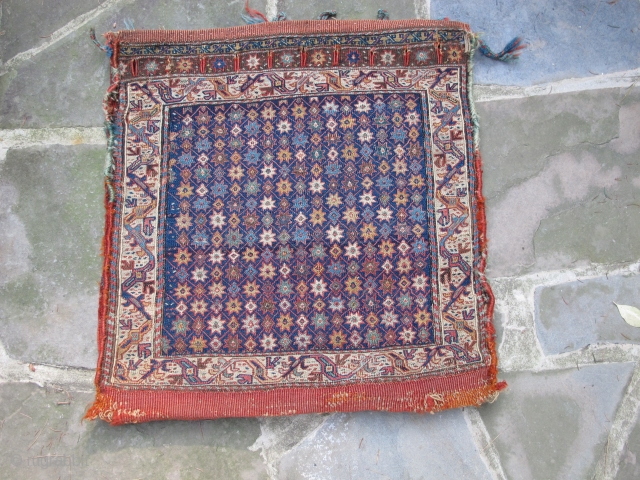 Khamseh Sumak saddle bag with original back, remnants of side wrappings and loop closures, border design
seen in early dragon and floral carpets, mid 19th. century, 24" X 23"(61 X 59cm), excellent condition,
no  ...