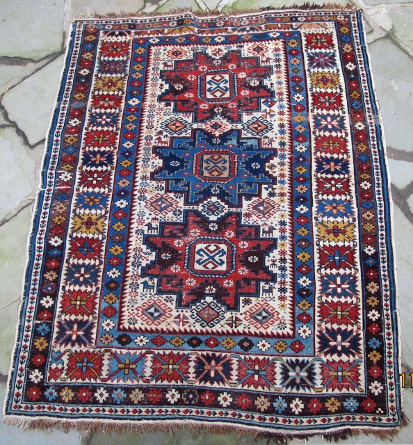 Finely woven Daghestan from the Caucasus, acceptably low pile, original selvedges, original kelim end finishes with knotted warps, early natural colors including a wonderful maroon, 19th century, 56" X 45"[143 X 114cm]

 