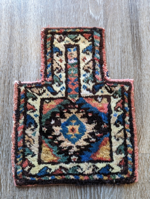 A beautiful Kurd carpet saltbag, circa 1950,a wonderful range of colors with a nice colorful back. size 1'1" by 1'4"             