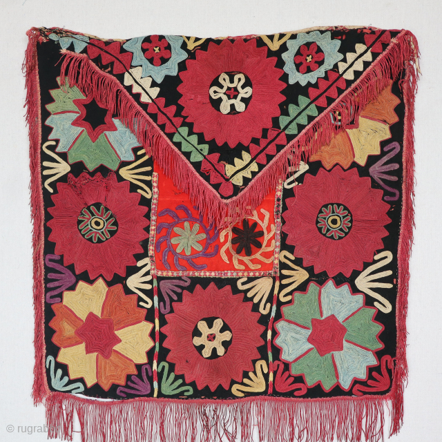 An exceptionally rare antique enveloped-shaped needlepoint embroidered textile made by the famous Lakai tribe of Uzbekistan circa the late 19th Century, named Aina Khalita(wedding mirror bag) It has a spectacular color range  ...