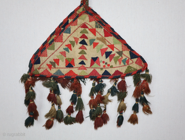 A pair of Antique Yumut pot holders, circa 1900 or earlier. They are connected by a beautifully woven kilim. They have wonderful original tassels attached. The design is different on each piece. ...