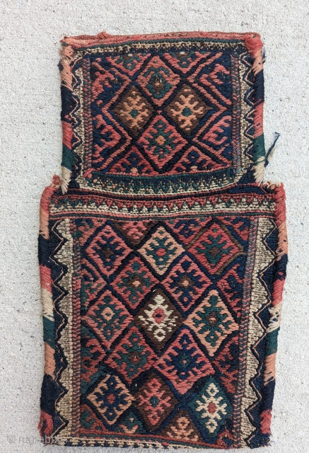 A Dynamic Antique Kurd salt bag, a wonderful array of colors with a unique shape, circa 1910 or before with a nice original back. excellent condition, size 1'2" by 1'11"   