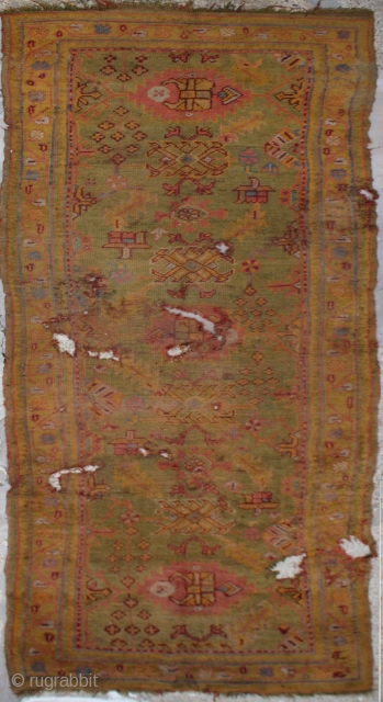 Antique Ushak Carpet,	
Age:Antique,
Origin: Turkish	
City/Village: 	Ushak,
Size cm: 	370 x 123 -
Size ft: 	12'4 x 4'1 -
Code No: 	R5992 -
Availability: 	In Stock - This rug is over hundred years old and some major damage 