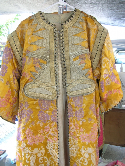 Old Afg coat with beautiful silver embroidery on it.                        