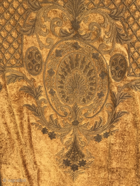 19th C. Chenille Portiere

Burnished gold colored chenille embroidery with bottom end oval and fan (14” W x 17”L) with floral stems and a floral bouquet at top (24” W x 43” L).  ...