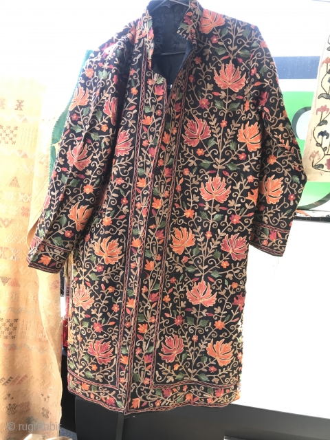 Kashmir Hand Embroidered Coat

Floral vine and flower “ari-work” hand embroidery with large chinar leaf and small flower pattern on heavier black raw silk. Front opening with silk covered buttons. Lined with black  ...