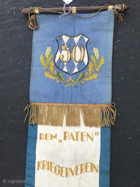 Warriors and Weapons Brotherhood Club Banner
Banner probably celebrating 50 year anniversary in 1927. Blue and cream silk with gold metallic embroidery and 2” fringe. Top hand embroidery shows shield with “50” and  ...