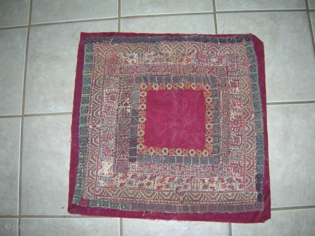 Greek Island silk pieced embroidery attached to a burgundy velvet ground.
Size: 22 inches x 23 inches (with backing material); 21 inches x 21 inches (without backing) Age: 19th century .
 
  