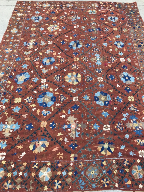 Rare color Bokhara Suzani

Rust color hand woven linen background with lattice and floral patterns, Over all chain stitch used predominately for design except a few areas of basma stitch. Nine colors of:  ...