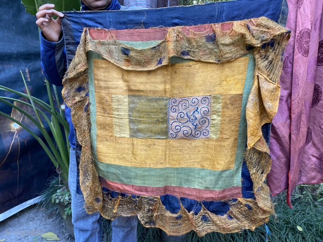 Chinese silks joined to make a ritual Tibetan mandala offering canopy 
to hang directly over the mandala
Petit point embroidery and a woven kalachakra symbol surrounded by Ming period 
golden silk with a  ...