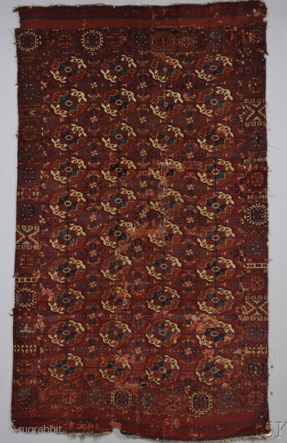 Akhal Tekke carpet fragment(originally 5 x 10 rows of guls). A warm, sumptuous, rich red with the early dark turquoise and deep blue. It also has the double tick guard stripes, a  ...