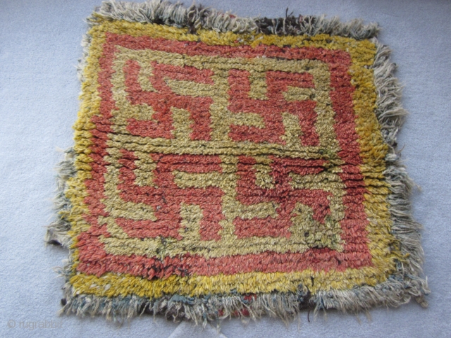 Tibetan wangden monastic meditation seating square with a Five swastika design. This is a rare and early piece.               