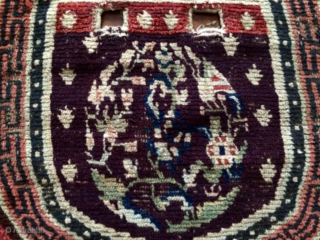 Early Tibetan saddle rug, aubergine ground and amazing Tang style medallions.                      