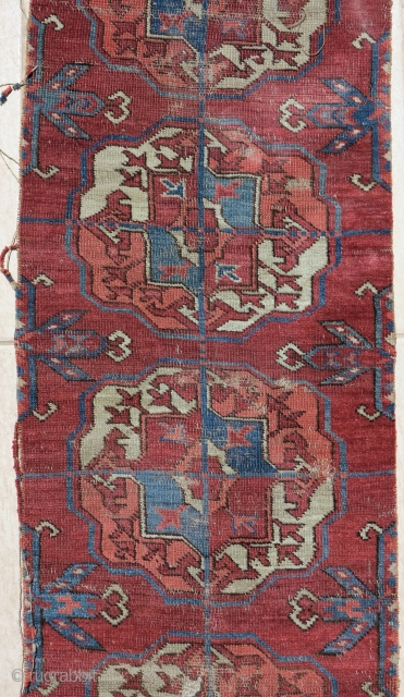 old Tekke Turkmen main carpet fragment from an early or mid century piece. A vertical strip with 10 guls representing the full vertical height of the field.  Several old and strange  ...