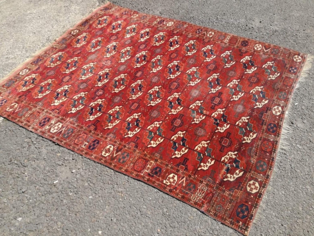 An antique Tekke main carpet  . 220/200 cm. Very old and Fine. Some repairs. Original size.                