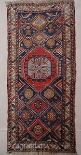 East Caucasus village rug. 1890 - 1915. 120 x 250 cm.
All wool. Pile: Glossy 4-6 mm high.
A rare rug with non-commersial size and with nomad structure and drawing. Some pattern element are  ...