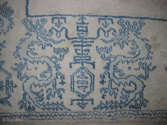 Important Agra cotton carpet with Coat of Arms, Condition three small holes, measuring 11 x 9 feet approximately.               