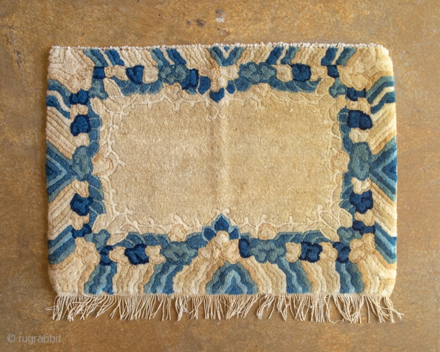 Antique Tibetan seat cover. This gorgeous seat cover features rainy skies and very soft, hand-spun natural wool.

width: 1'5"
length: 2'1"
size category: 3'x5' and smaller
dominant colors: rich Beiges & Blues     